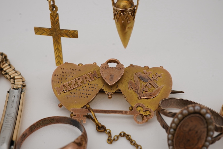 A group of jewels, comprising: a late 19th century 'Mizpah' brooch, stamped 9CT; a 9ct gold ring, British hallmark; a ruby and diamond ring, partial British hallmarks; a diamond stick pin, stamped 15CT, an aquamarine sti